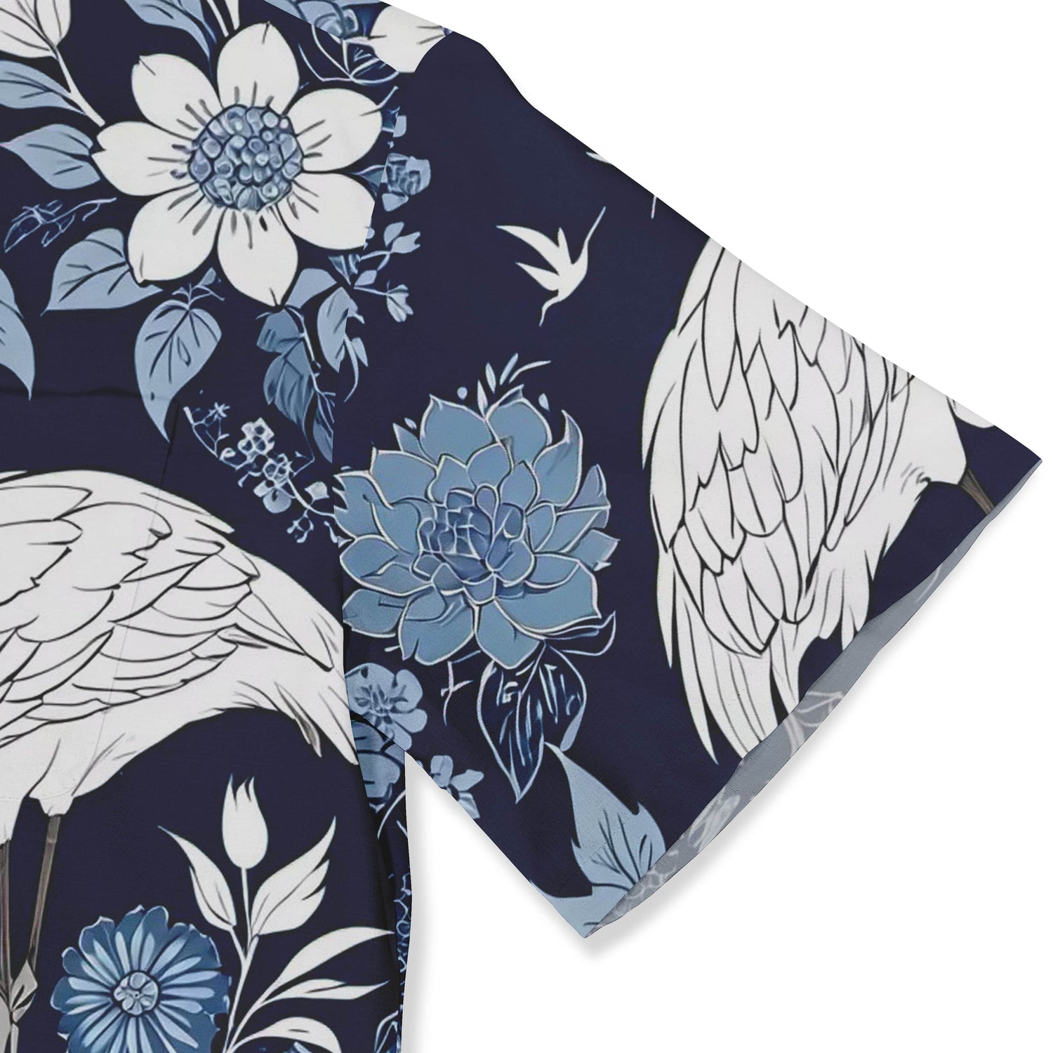 Shirt featuring intricate crane and floral patterns in blue and white hues.