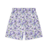 A pair of shorts featuring intricate purple and green flowers on a light background, creating a soft and elegant floral design.