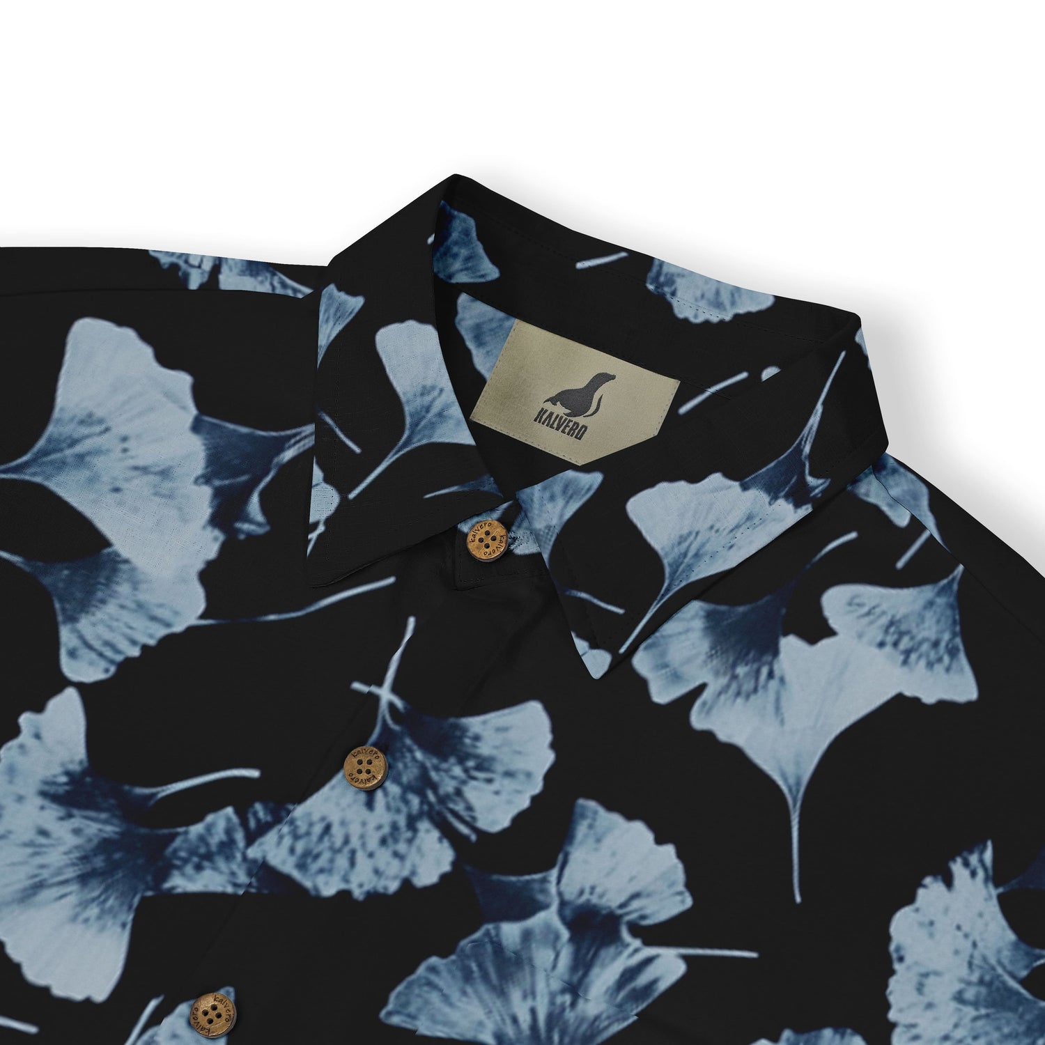 Elegant ginkgo leaf design on a dark shirt.