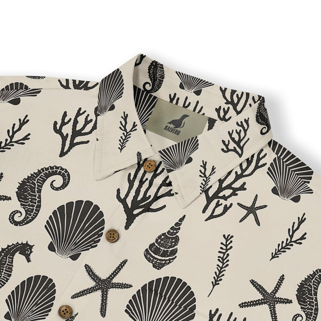 Detailed pattern of starfish and coral on a beach-themed shirt.