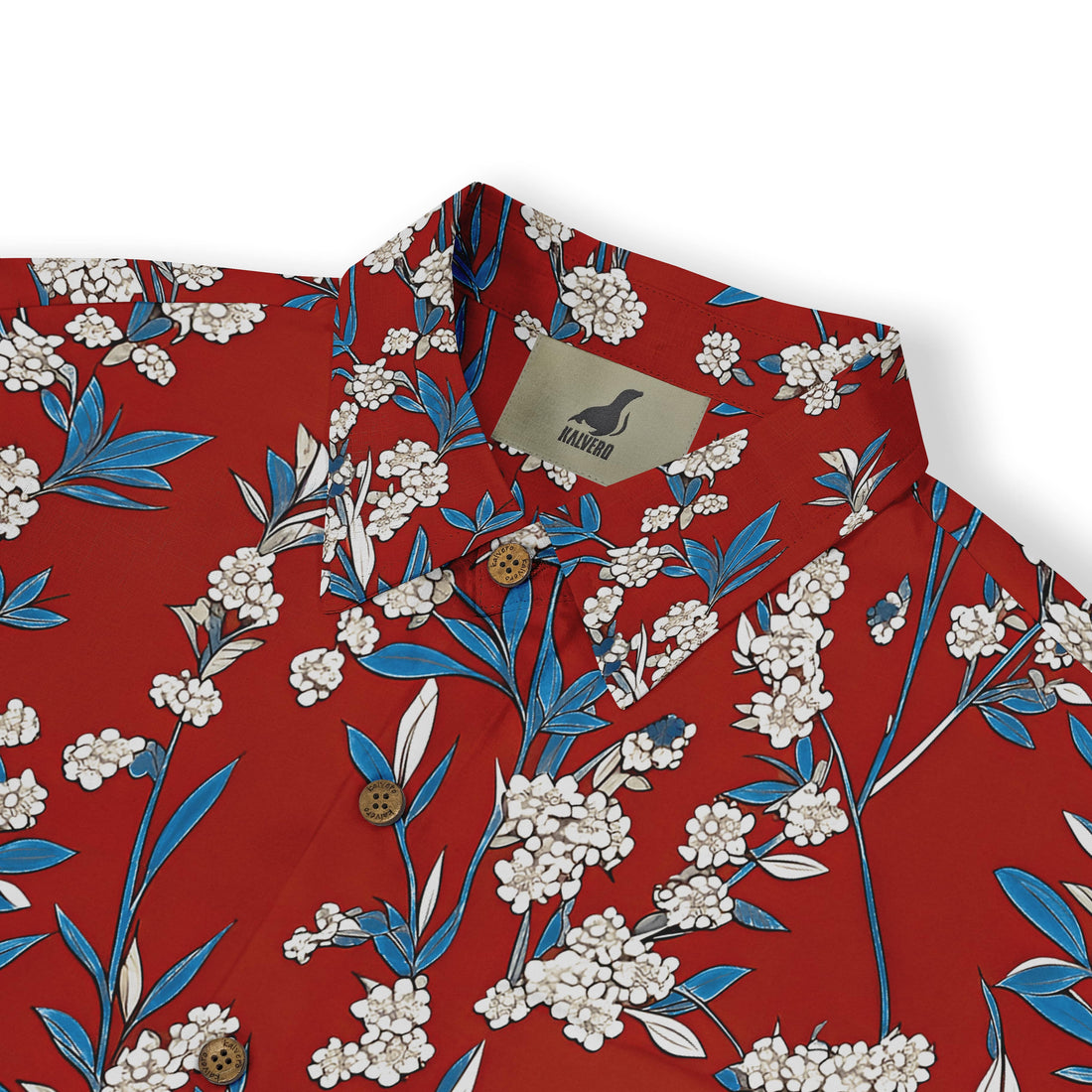 Close-up of intricate white floral patterns on a red shirt.