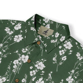 Close-up of a green shirt adorned with white flowers, evoking a tranquil and peaceful feel.