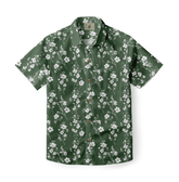 Green shirt with white floral pattern, showcasing delicate blossoms in a serene design.