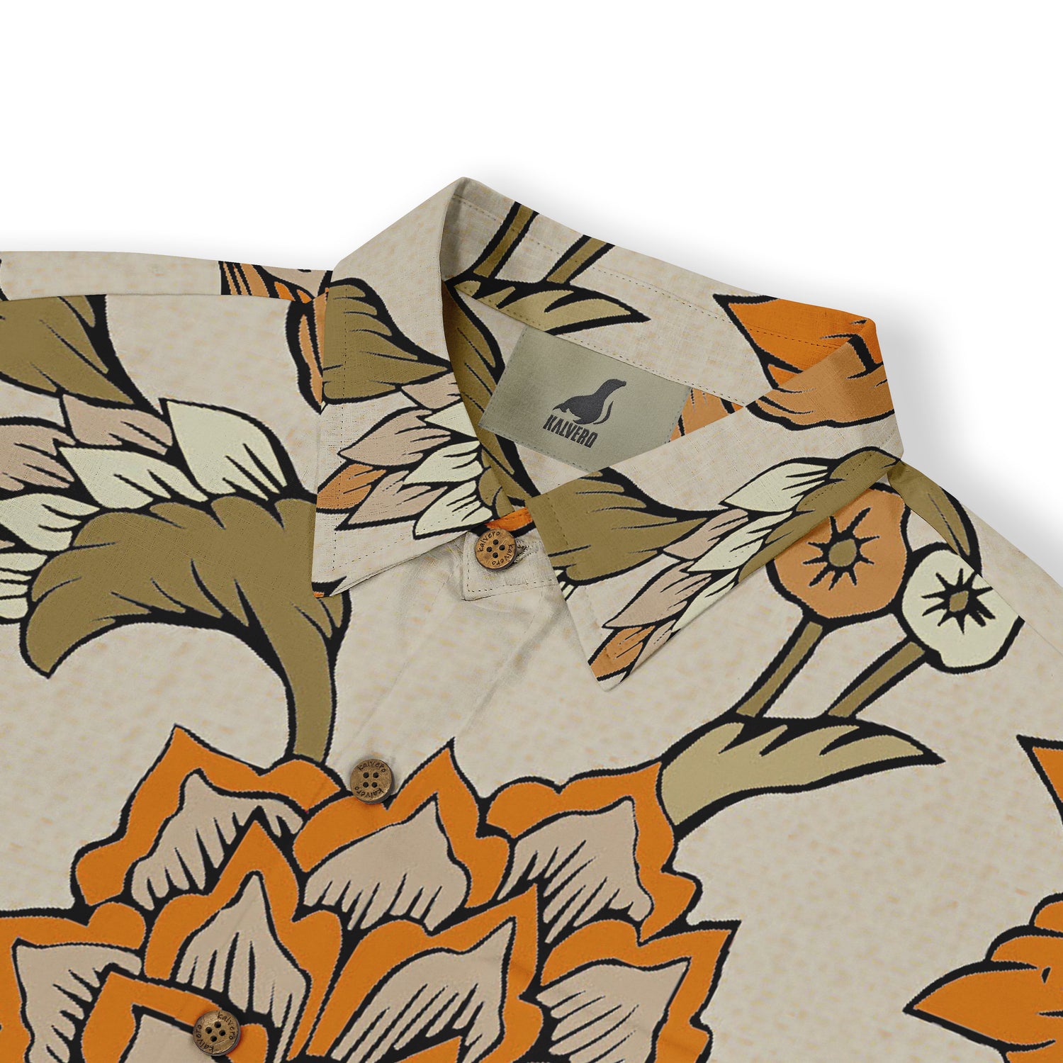 Close-up of a beige shirt collar featuring an intricate floral pattern with orange, green, and beige tones.