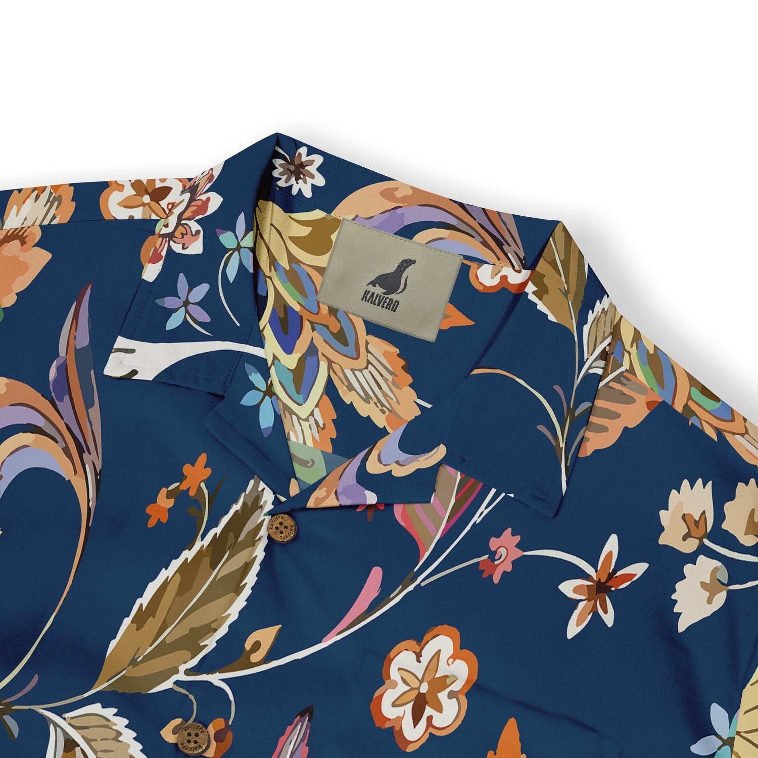 Close-up of a vibrant floral print shirt with a navy base, highlighting intricate leaf and flower patterns in warm, earthy tones.