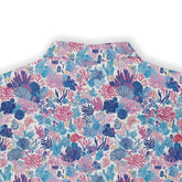 Colorful shirt featuring detailed coral reef and marine life designs in shades of blue, pink, and purple back view