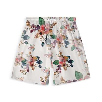 This image shows a pair of shorts featuring a delicate floral design in a watercolor style. The pattern includes flowers and leaves in soft shades of pink, green, and brown on a white background, giving the shorts a light and airy appearance perfect for a relaxed, summery vibe.