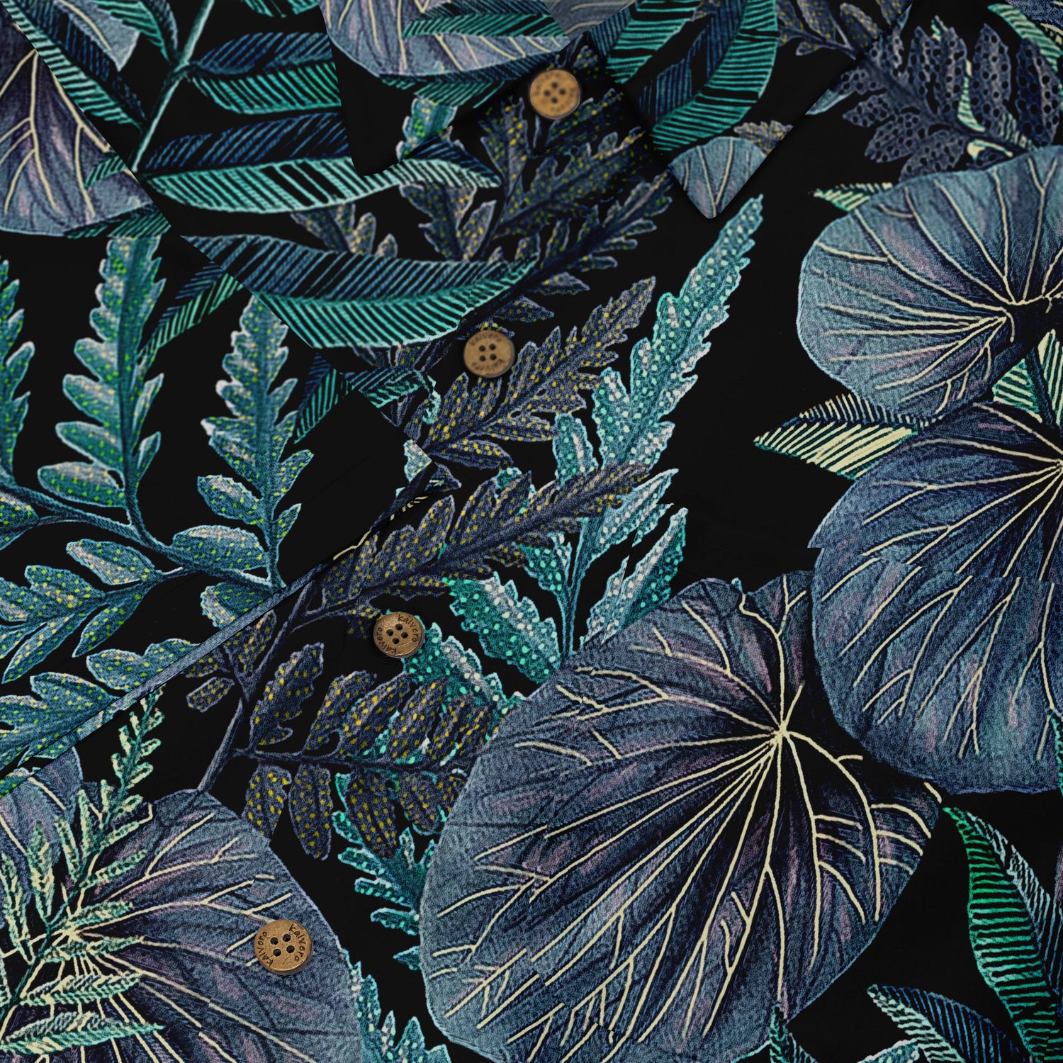 A close-up of a Hawaiian shirt featuring detailed tropical foliage in various shades of blue and green against a dark background. The intricate leaf patterns, highlighted by buttons, create a lush and vibrant design that captures the essence of tropical nature.