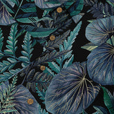 A close-up of a Hawaiian shirt featuring detailed tropical foliage in various shades of blue and green against a dark background. The intricate leaf patterns, highlighted by buttons, create a lush and vibrant design that captures the essence of tropical nature.