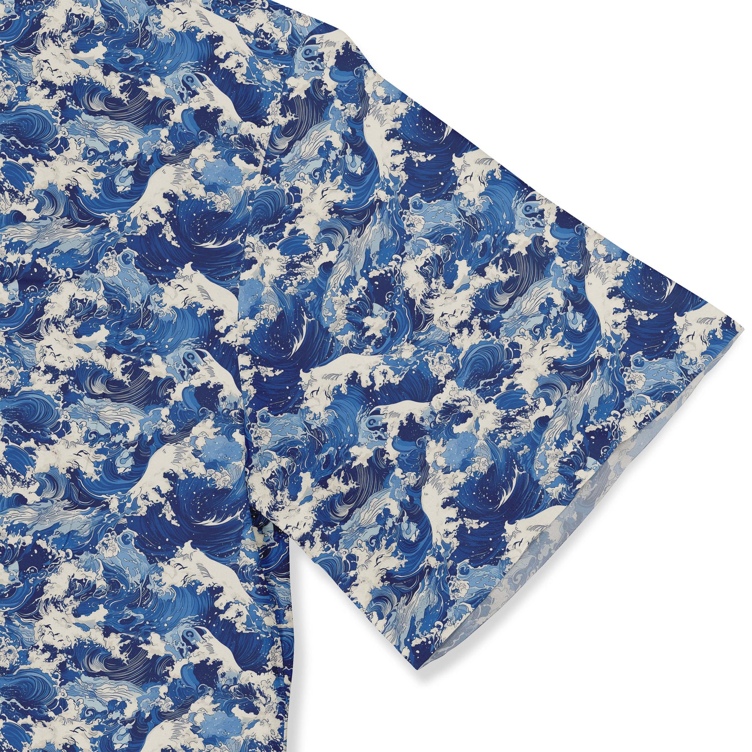 Shirt with a design featuring dynamic ocean waves and leaping dolphins in deep blue and white hues inspired by traditional Japanese wave art close-up