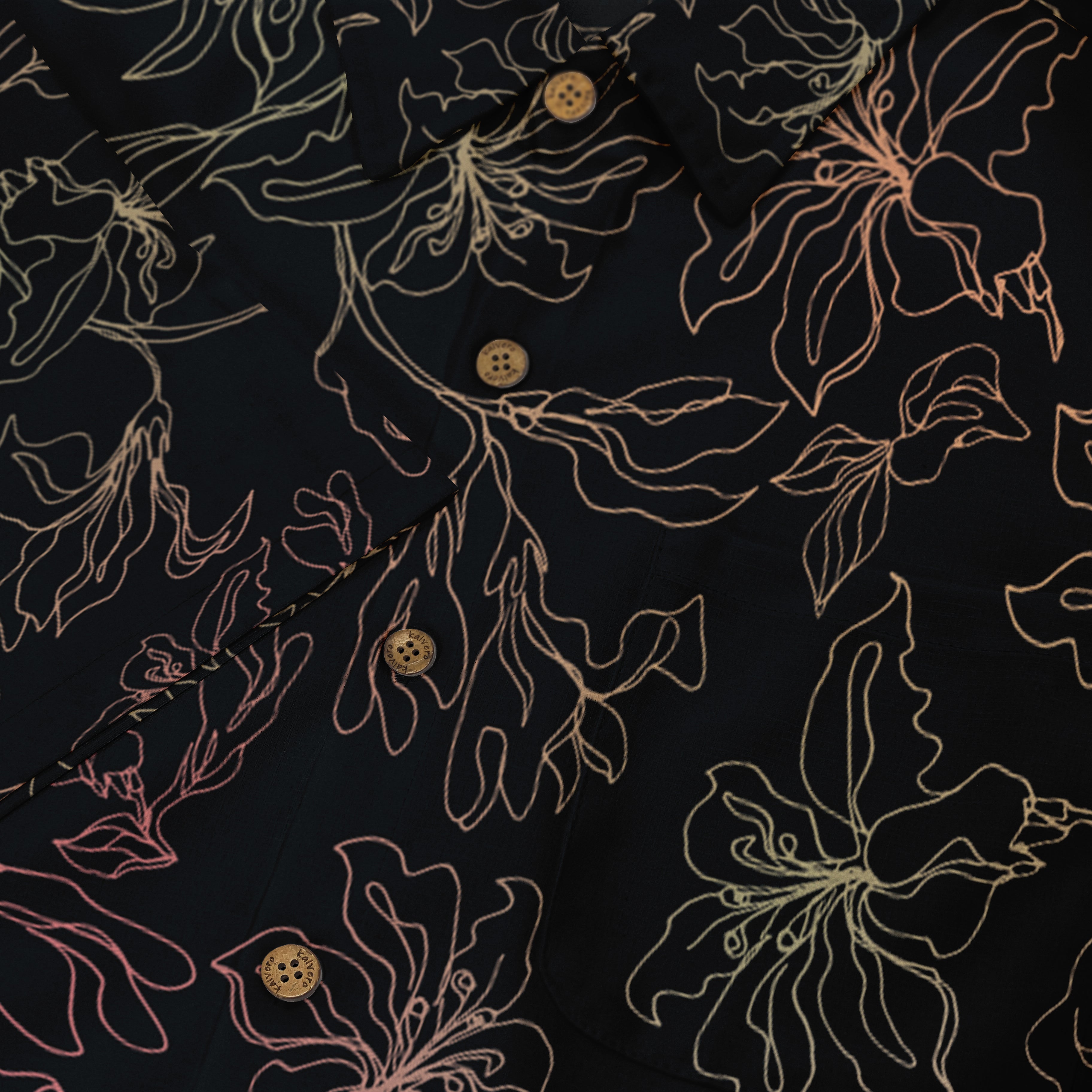 This close-up image showcases a delicate floral pattern on a dark shirt, with light lines creating a refined, elegant contrast against the fabric.