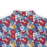 A colorful shirt with an array of vibrant flowers including daisies, cosmos, and hibiscus on a blue background. back view