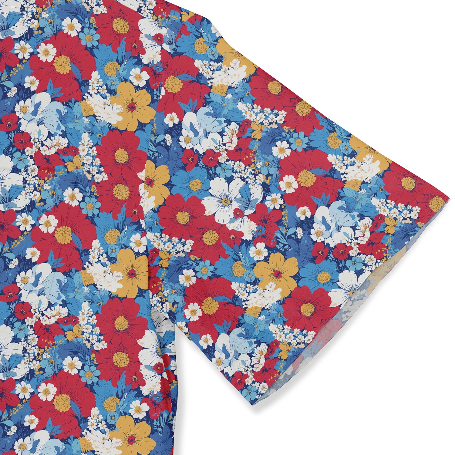 A colorful shirt with an array of vibrant flowers including daisies, cosmos, and hibiscus on a blue background. close-up